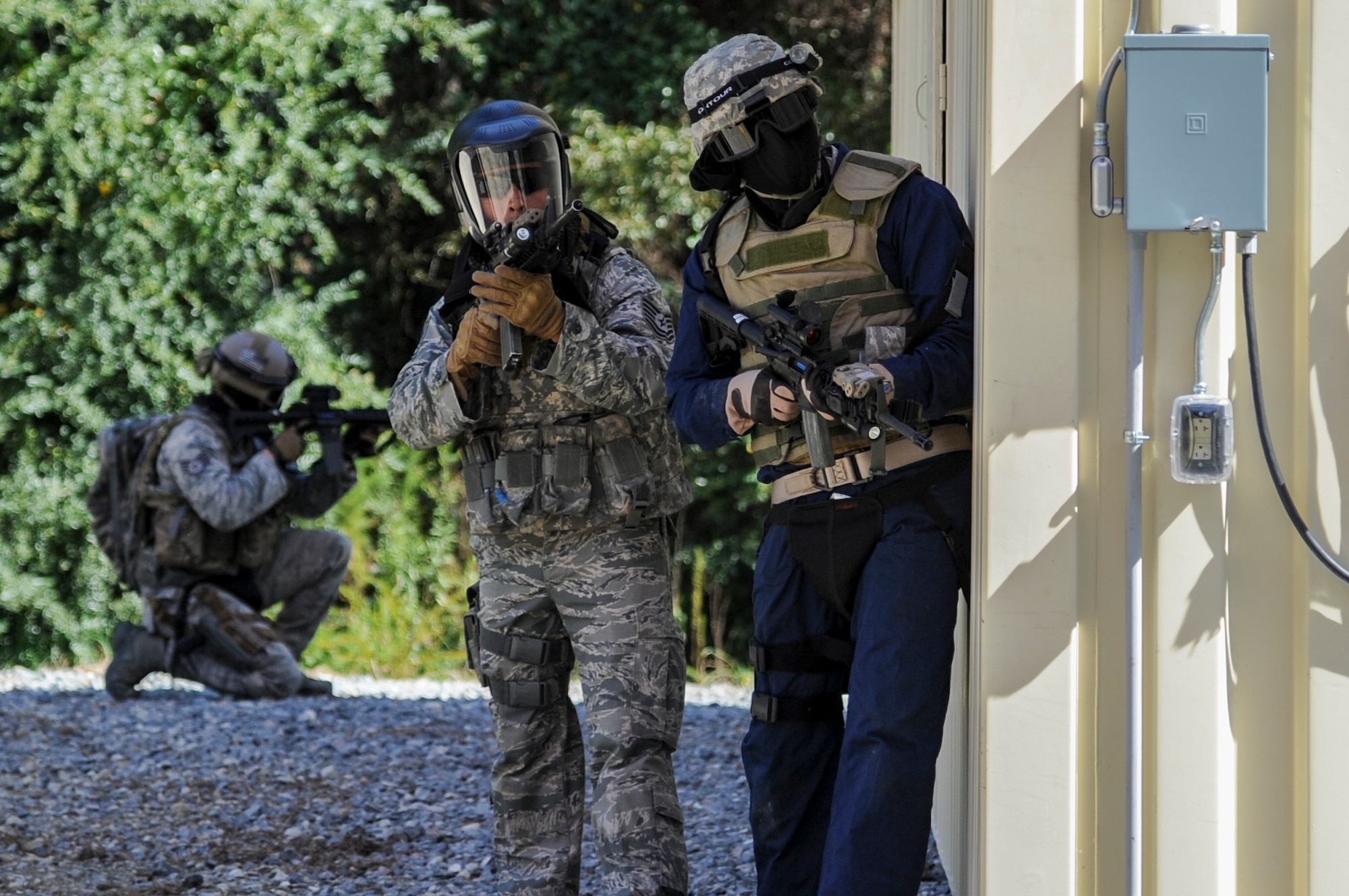 Chief Master Sgt. of the Air Force James Cody (right) and a 4th Security Forces Squadron defender take defensive positions during a tactical operation exercise at the 4th SFS shoot house at Seymour Johnson Air Force Base, North Carolina, Oct. 9. “We showed the chief what we do both at home and deployed,” said Staff Sgt. Justin Hovis of the 4th SFS. “We got him geared up, we took some fire, returned some fire, and cleared a few facilities, and the chief led us in the clearing of a few of the rooms. He did a great job staying with the team, keeping up with it. He was moving fast.” (U.S. Air Force photo/Airman 1st Class Ashley Thum) 