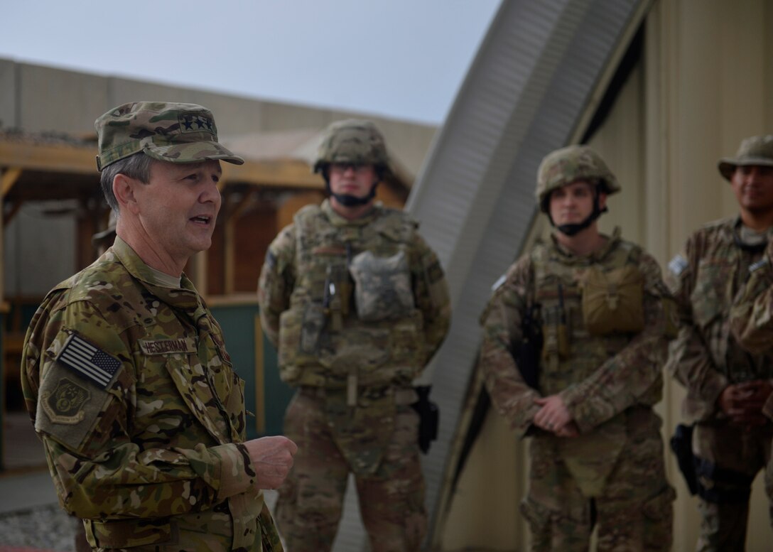 U.S. Air Force Lt. Gen. John Hesterman, U.S. Air Forces Central Command commander, speaks with Airmen from the 455th Expeditionary Communications Squadron at Bagram Airfield, Afghanistan Oct. 7, 2014. Hesterman visited several units and thanked Airmen for their service.  (U.S. Air Force photo by Staff Sgt. Evelyn Chavez/Released)