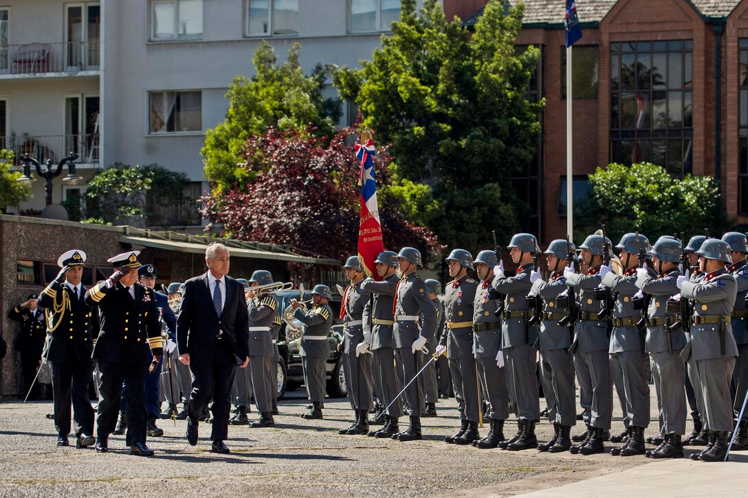 A Chilean military honor guard member gives commands during a ceremony to greet U.S. Defense Chuck Hagel (not pictured) as he arrives at the Defense Ministry in Santiago, Chile, Oct. 11, 2014.