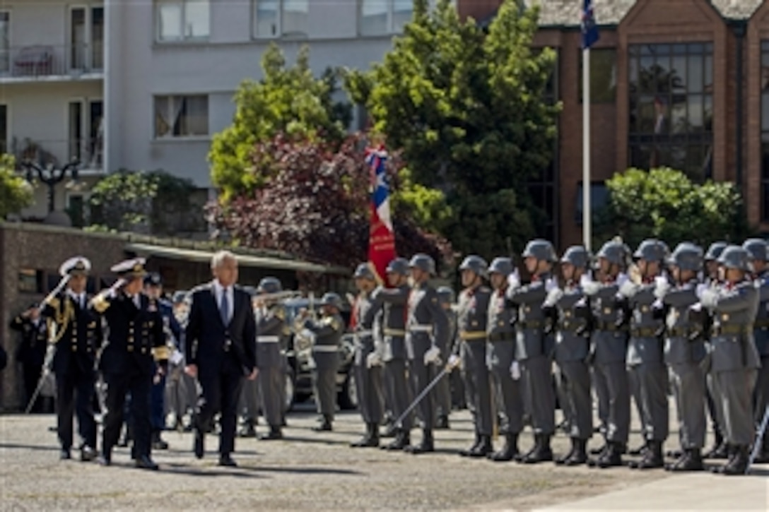 A Chilean military honor guard greets U.S. Defense Secretary Chuck Hagel as he arrives at the Defense Ministry in Santiago, Chile, Oct. 11, 2014, to meet with Chilean Defense Minister Jorge Burgos to discuss matters of mutual importance. Hagel earlier visited Colombia and will travel to Peru during his six-day trip to South America.