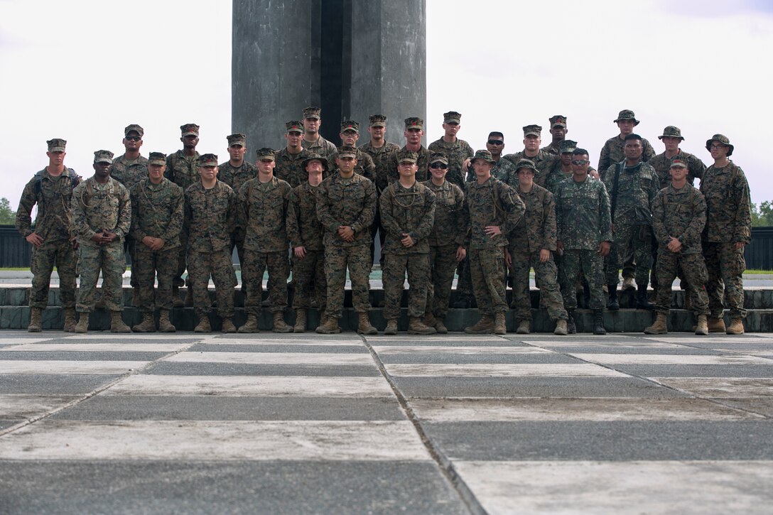 Philippine Marines and U. S. Marines stand together after paying their respects to those who died during the Bataan Death March during Amphibious Landing Exercise 15 Oct. 8, 2014. More then 100 Marines visited the memorial over two days to learn more about the events of World War II that occurred in the Philippines. PHIBLEX is an annual, bilateral training exercise conducted by members of the Armed Forces of the Philippines alongside U.S. Marine and Navy Forces focused on strengthening the partnership and relationships between the two nations across a range of military operations including disaster relief and complex expeditionary operations. The U. S. Marines are from Combat Logistics Battalion 31, 31st Marine Expeditionary Unit.