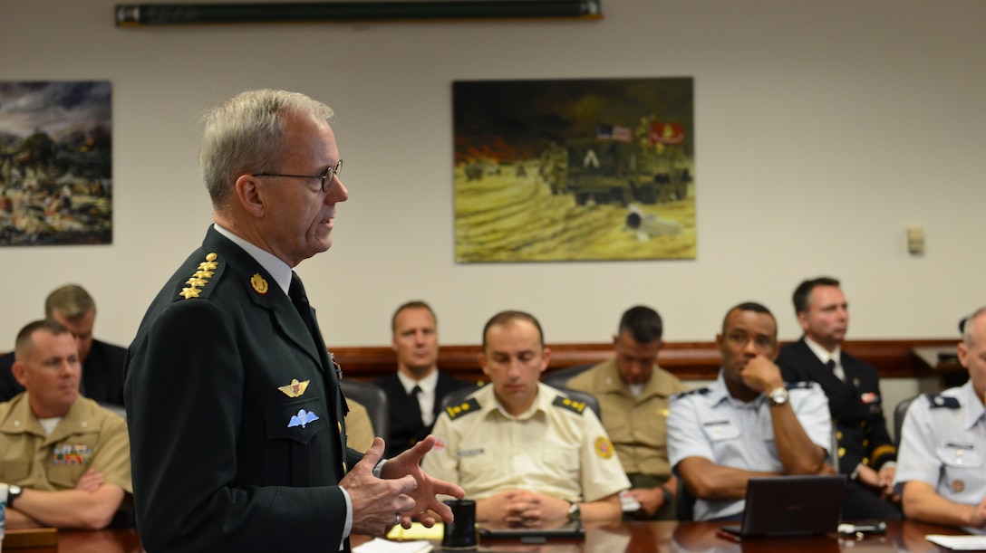 Danish Gen. Knud Bartels, front left, Chairman of the North Atlantic Treaty Organization Military Committee, briefs a group of students attending the Marine Corps War College at Marine Corps Base Quantico, Virginia Oct. 3, 2014 during his tour of the United States. “The greatest responsibility of the Alliance is to protect and defend our territories and our populations against attack, as set out in Article 5 of the Washington Treaty,” said Bartels. “Our Alliance remains an essential source of stability in this unpredictable world.” 