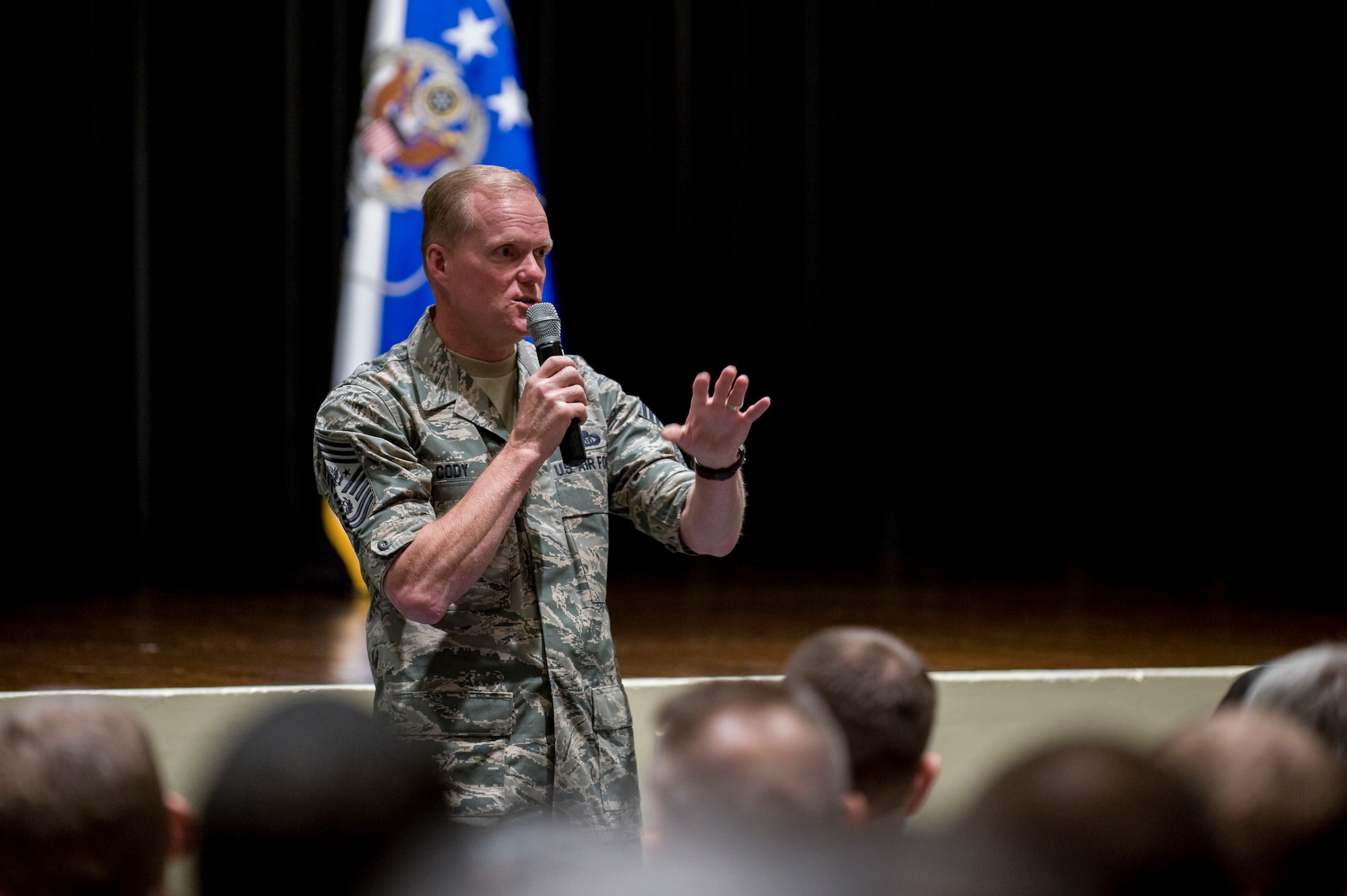 Chief Master Sgt. of the Air Force James Cody addresses the crowd during an all call Oct. 9, 2014, at Seymour Johnson Air Force Base, N.C. Cody paid visits to several units throughout the 4th Fighter Wing as well as the base’s Reserve component, the 916th Air Refueling Wing. During his all calls, Cody discussed force management, professional military education, the enlisted evaluation and promotion system, and the challenges ahead for the Air Force. (U.S. Air Force photo/Airman 1st Class Aaron Jenne)