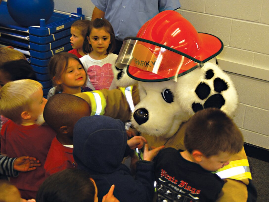Sparky the Fire Dog entertains children at the Child Development Center on Oct. 9. Sparky’s appearance was part of Fire Prevention Week 2014 festivities from Oct. 6-10.