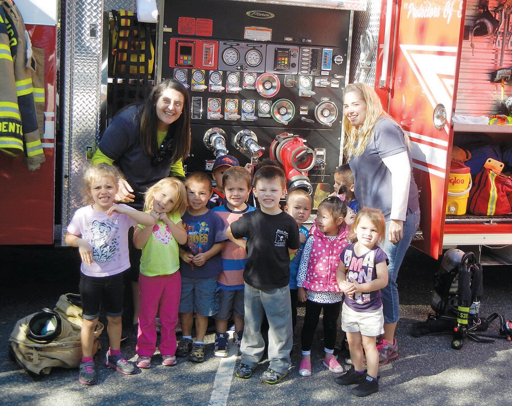 Firefighter Doug Pierson speaks to children at the Child Development Center on Oct. 9 as part of Fire Prevention Week 2014 festivities.
