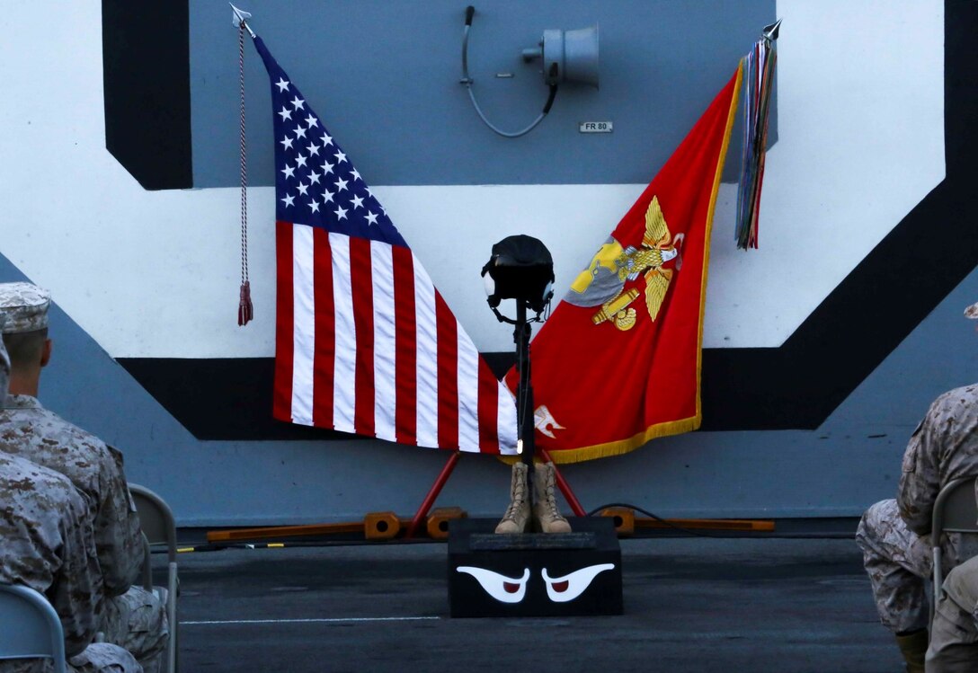 5TH FLEET AREA OF RESPONSIBILITY (Oct. 8, 2014) – Marines with Marine Medium Tiltrotor Squadron 163 (Reinforced), 11th Marine Expeditionary Unit (MEU), place a memorial stand for Cpl. Jordan Spears on the flight deck of the USS Makin Island (LHD 8) as part of his memorial, Oct. 8. Cpl. Spears was lost at sea Oct. 1 during flight operations off the Makin Island. The 11th MEU is embarked with the Makin Island Amphibious Ready Group and deployed to maintain regional security in the U.S. 5th Fleet area of responsibility.  (U.S. Marine Corps photo by Cpl. Laura Y. Raga/RELEASED)