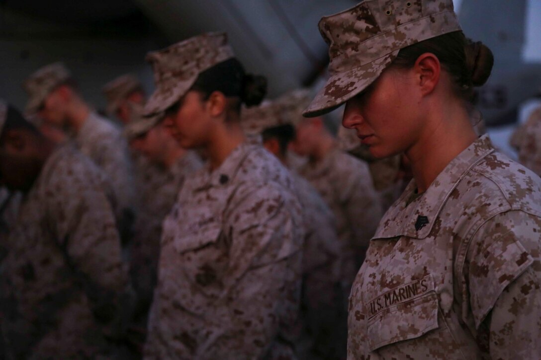 5TH FLEET AREA OF RESPONSIBILITY (Oct. 8, 2014) – Marines with the 11th Marine Expeditionary Unit (MEU) listen to remarks are being delivered during the memorial ceremony for Cpl. Jordan Spears on the flight deck of the USS Makin Island (LHD 8), Oct. 8. Cpl. Spears was lost at sea Oct. 1 during flight operations off the Makin Island. The 11th MEU is deployed with the Makin Island Amphibious Ready Group as a theater reserve and crisis response force throughout U.S. Central Command and the U.S. 5th Fleet area of responsibility. (U.S. Marine Corps photo by Cpl. Laura Y. Raga/RELEASED)