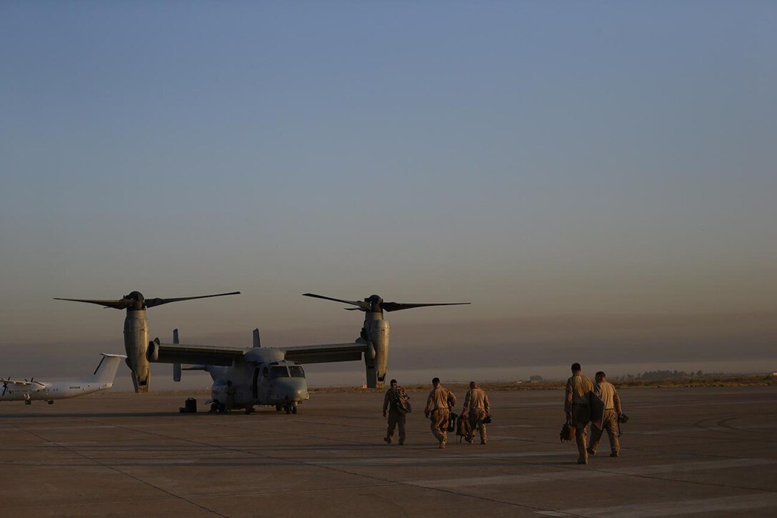 Marines with the 11th Marine Expeditionary Unit (MEU) move to an MV-22B Osprey, with Marine Medium Tiltrotor Squadron 261, for re-posturing in support of potential missions. The 11th MEU is deployed with the Makin Island Amphibious Ready Group as a theater reserve and crisis response force throughout U.S. Central Command and the U.S. 5th Fleet area of responsibility. (U.S. Marine Corps photo by Lance Cpl. Evan R. White/Released)