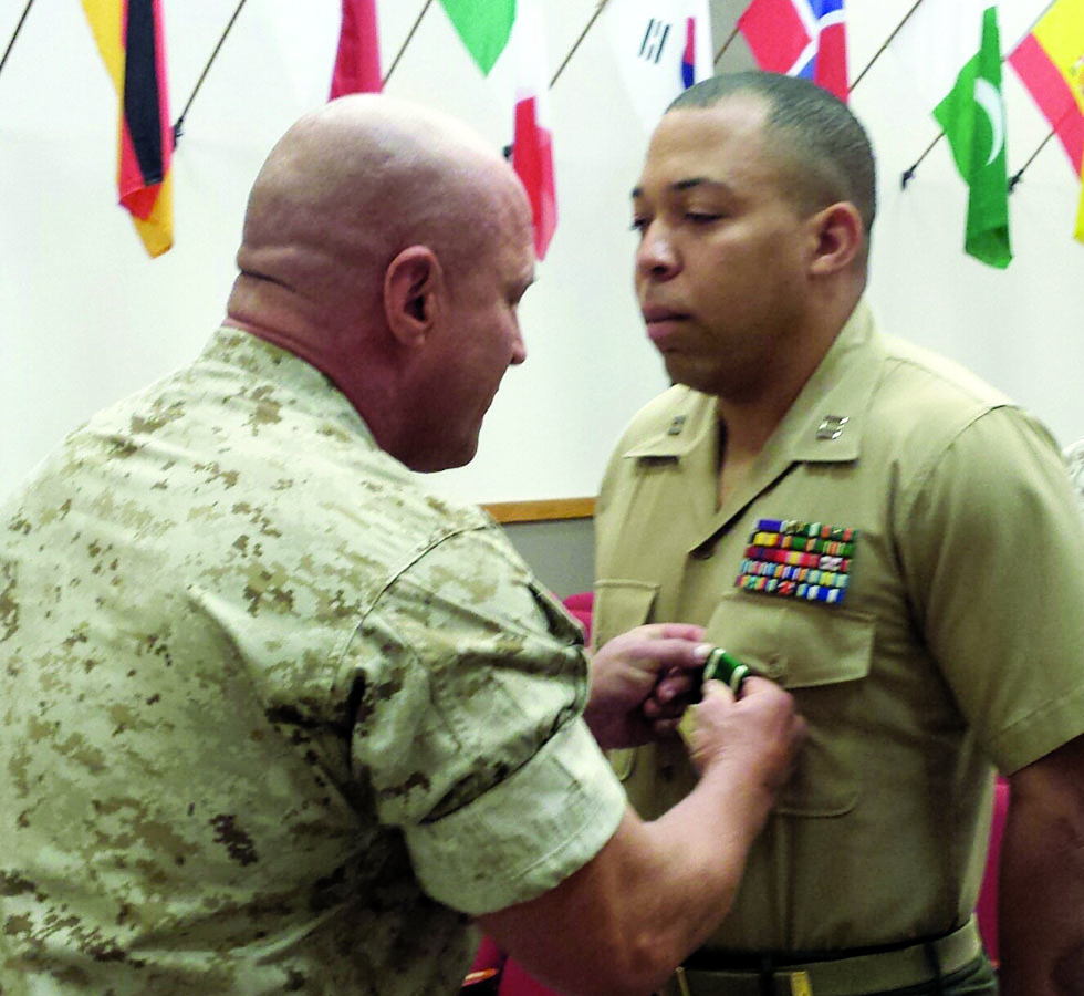 Col. Todd S. Tomko, commanding officer, Wounded Warrior Regiment, recently presented the Navy and Marine Corps Commendation Medal to Capt. Antoine Bates for his efforts in bettering the lives of Wounded Warriors. (photo courtesy of the Wounded Warrior Regiment)