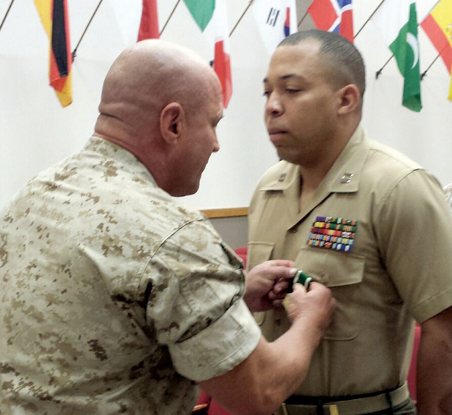 Col. Todd S. Tomko, commanding officer, Wounded Warrior Regiment, recently presented the Navy and Marine Corps Commendation Medal to Capt. Antoine Bates for his efforts in bettering the lives of Wounded Warriors. (photo courtesy of the Wounded Warrior Regiment)