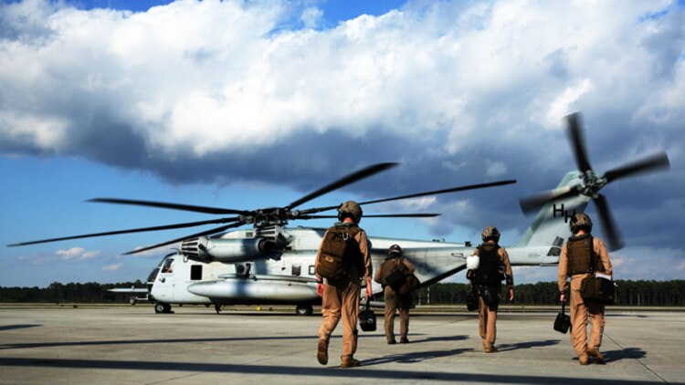 Pilots and crew members with Marine Heavy Helicopter Squadron 366 board a CH-53E Super Stallion at Marine Corps Air Station Cherry Point, N.C., before conducting aerial refueling training off the coast of North Carolina Oct. 8, 2014.