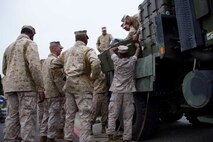 Marines with Combat Logistics Battalion 13 unload equipment from a truck to set up a humanitarian assistance and disaster relief village for San Francisco Fleet Week 2014, Oct. 10. During the course of fleet week, Marines have been demonstrating assets available for the Bay Area in response to a sudden crisis. The intent is to showcase amphibious nature, readiness and the ability to respond to disasters and highlight the role the Navy-Marine Corps team can play in assisting disaster victims.