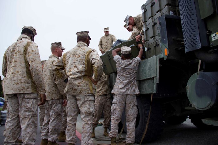 Marines with Combat Logistics Battalion 13 unload equipment from a truck to set up a humanitarian assistance and disaster relief village for San Francisco Fleet Week 2014, Oct. 10. During the course of fleet week, Marines have been demonstrating assets available for the Bay Area in response to a sudden crisis. The intent is to showcase amphibious nature, readiness and the ability to respond to disasters and highlight the role the Navy-Marine Corps team can play in assisting disaster victims.