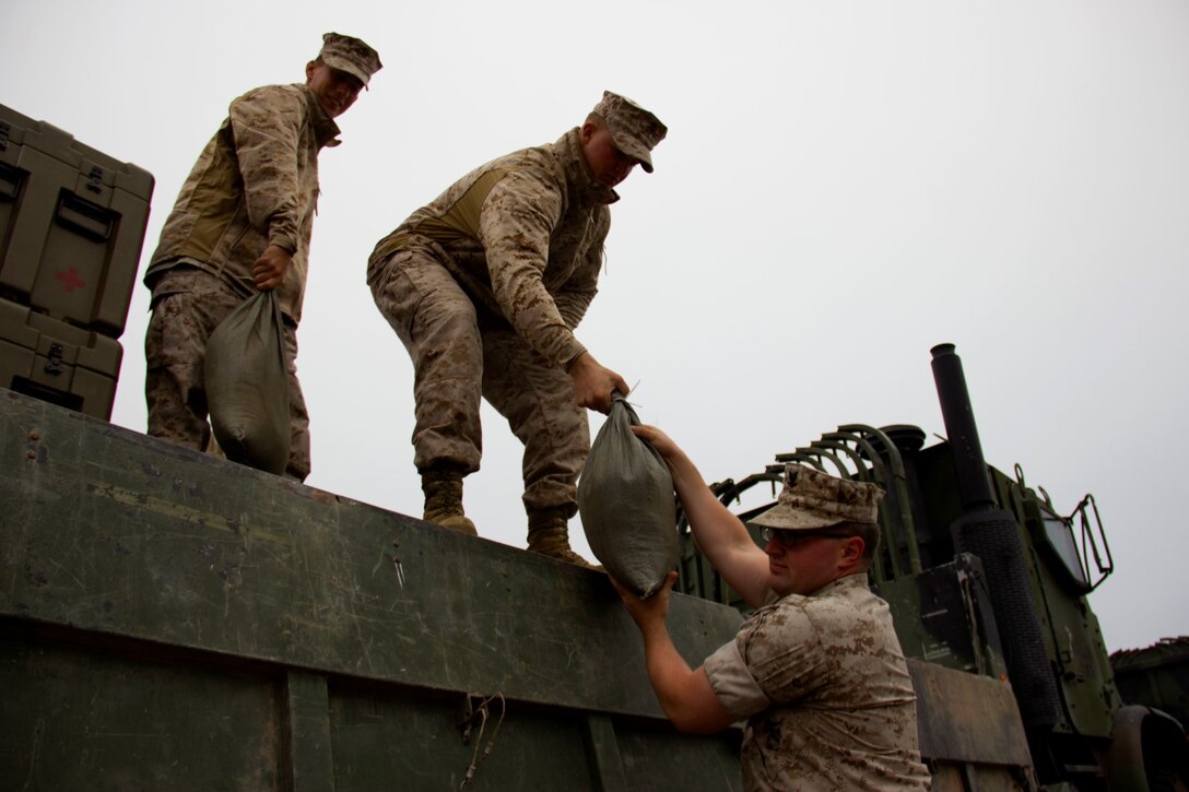 Marines with Combat Logistics Battalion 13 unload equipment from a truck to set up a humanitarian assistance and disaster relief village for San Francisco Fleet Week 2014, Oct. 10. During the course of fleet week, Marines have been demonstrating assets available for the Bay Area in response to a sudden crisis. The intent is to showcase amphibious nature, readiness and the ability to respond to disasters and highlight the role the Navy-Marine Corps team can play in assisting disaster victims.