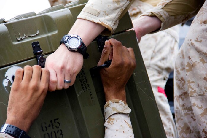 Marines with Combat Logistics Battalion 13 unload equipment from a truck to set up a humanitarian assistance and disaster relief village for San Francisco Fleet Week 2014, Oct. 10. During the course of fleet week, Marines have been demonstrating assets available for the Bay Area in response to a sudden crisis. The intent is to showcase amphibious nature, readiness and the ability to respond to disasters and highlight the role the Navy-Marine Corps team can play in assisting disaster victims.