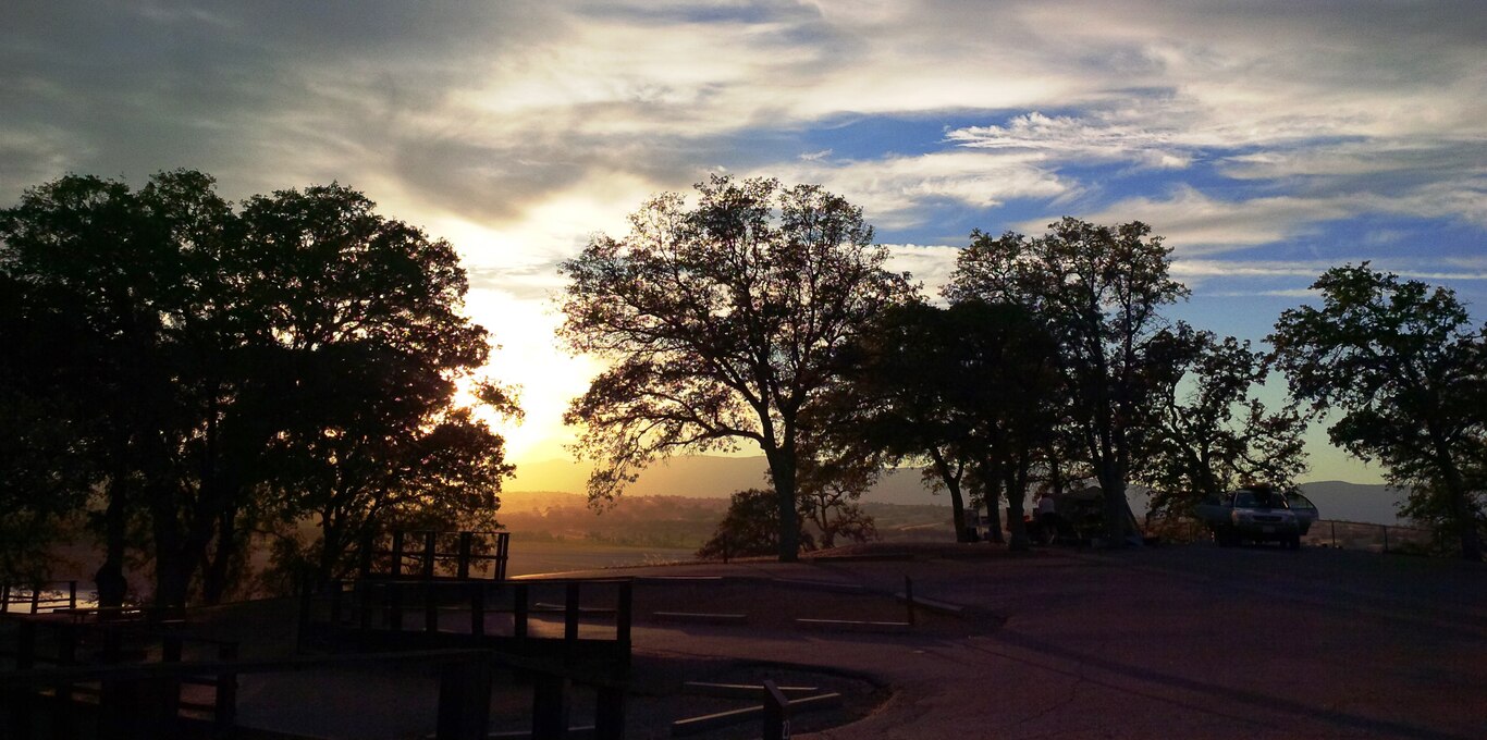 An early autumn sun sets over the hills at Black Butte Lake, near Orland, California.