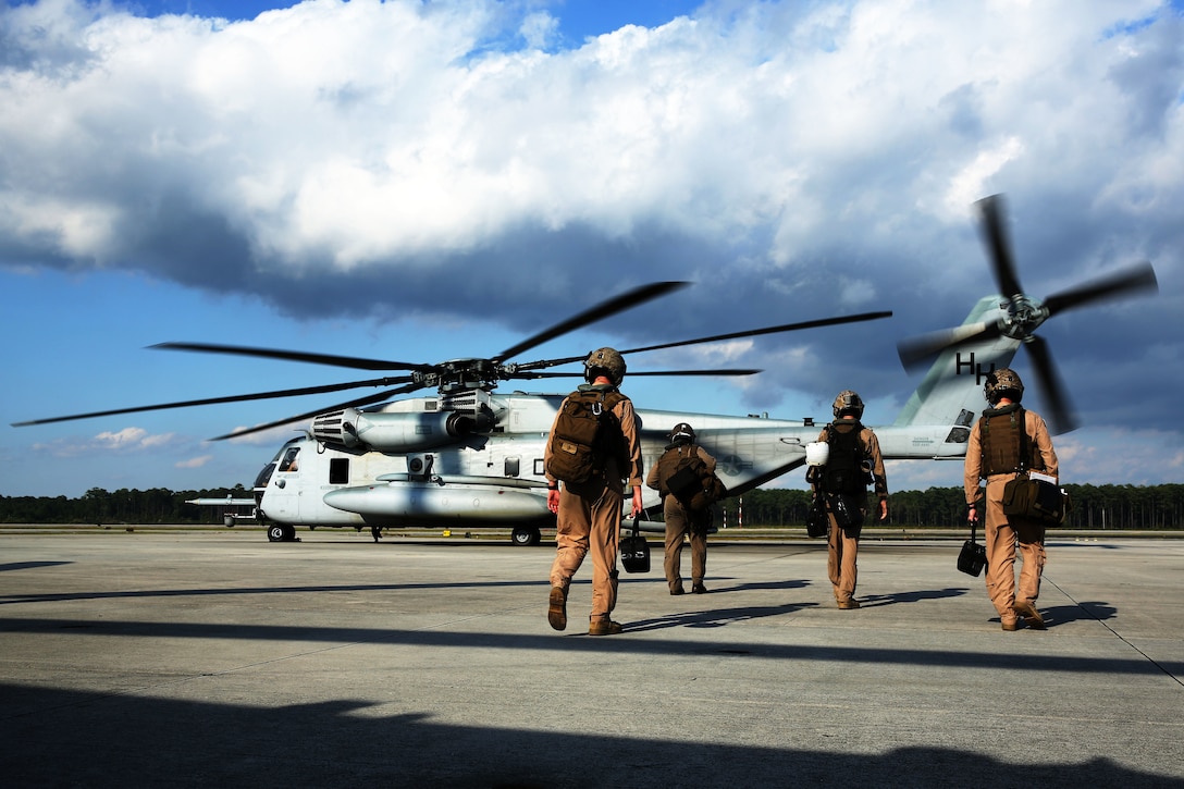 Pilots and crew members with Marine Heavy Helicopter Squadron 366 board a CH-53E Super Stallion at Marine Corps Air Station Cherry Point, N.C., before conducting aerial refueling training off the coast of North Carolina Oct. 8, 2014.