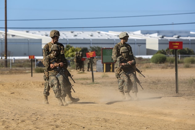 Recruits of Fox Company, 2nd Recruit Training Battalion, perform a buddy drag during the Crucible Confidence Course at Edson Range aboard Marine Corps Base Camp Pendleton, Calif., Sept. 30.  Though recruits had performed these types of events before, the addition of food and sleep deprivation added a new challenge for them to overcome
