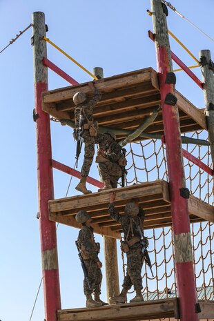 Recruits of Fox Company, 2nd Recruit Training Battalion, attempt to scale up the Skyscraper obstacle during the Crucible Confidence Course at Edson Range aboard Marine Corps Base Camp Pendleton, Calif., Sept. 30.  During the event, recruits quickly realized that teamwork was the only way to accomplish the events.
