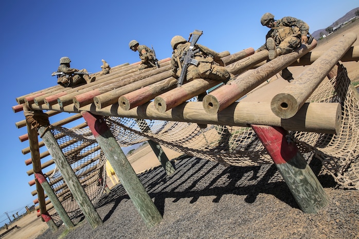Recruits of Fox Company, 2nd Recruit Training Battalion, navigate through the Weaver obstacle during the Crucible Confidence Course at Edson Range aboard Marine Corps Base Camp Pendleton, Calif., Sept. 30.  The event is part of the Crucible, which is a 54-hour test of endurance in which recruits must conquer more than 30 different obstacles while they experience food and sleep deprivation.