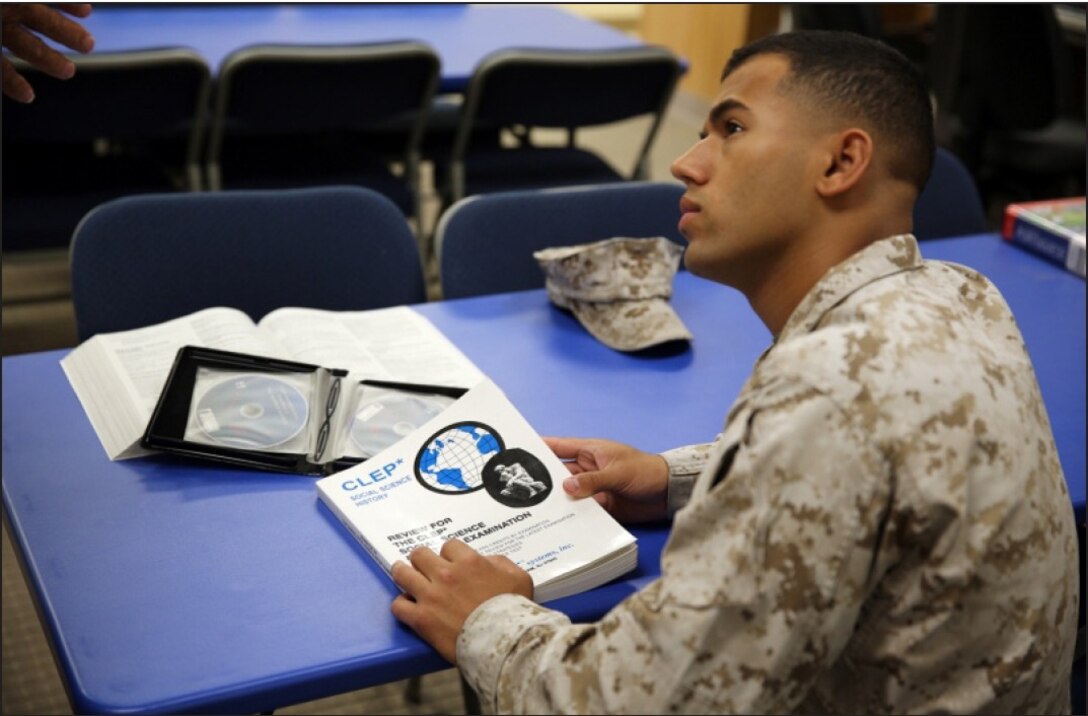 Corporal Samuel Ribeiro, adjutant noncommissioned officer in charge on Marine Corps Logistics Base Barstow, Calif., receives invaluable information about higher education, from the base education technicians.