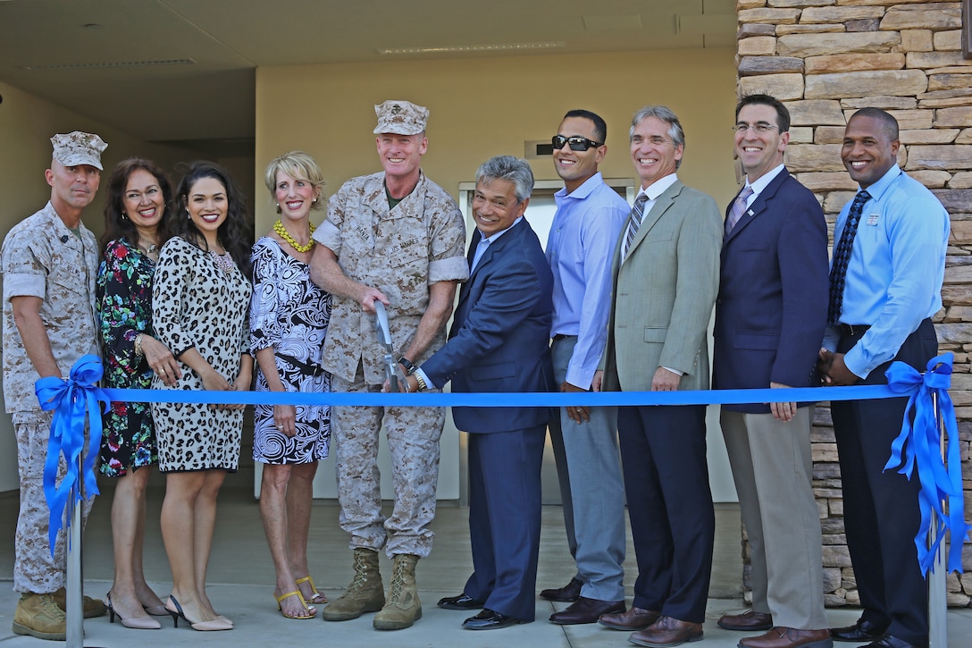 CAMP PENDLETON, Calif - Marine Corps Community Services held a ribbon cutting ceremony to celebrate the opening of Casa Del Mar, an events center here, Oct. 14. Brig. Gen. Edward D. Banta, center, Commanding General, and Sgt. Maj. Scott R. Helms, left, sergeant major, Marine Corps Base Camp Pendleton, Marine Corps Installations - West, were on hand for the ribbon cutting the ceremony. The events center is open for ceremonies and contains a conference room, a dining and banquet hall, a beach supplies shop and a mexican cantina. (Photo by Cpl. Shaltiel Dominguez)