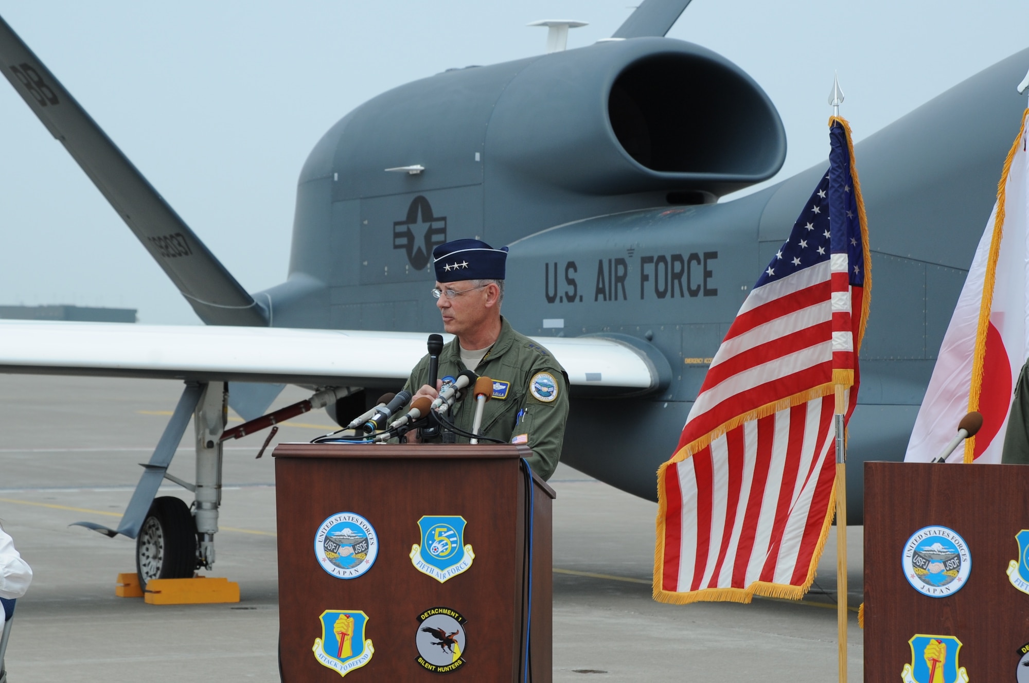 U.S. Air Force Lt. Gen. Sam Angelella, U.S. Forces Japan and 5th Air Force commander, speaks during a press conference in front of a RQ-4 Global Hawk at Misawa Air Base, Japan, May 30, 2014. Angelella’s visit included a trip to the Global Hawk hangar where he met with Japanese media to discuss the unmanned aircraft’s stay at Misawa. (U.S. Air Force photo by Tech. Sgt. April Quintanilla/Released)