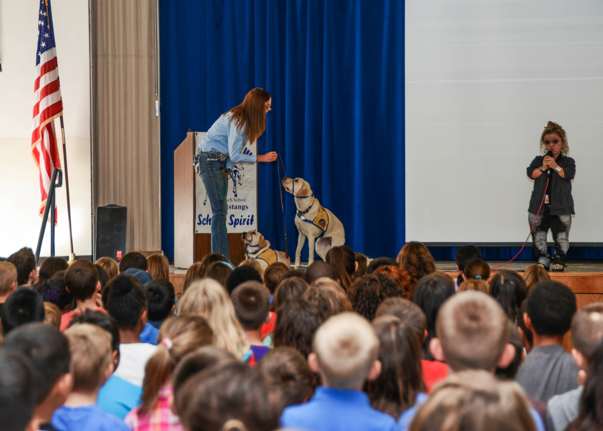 Melissa Billingsley, a volunteer puppy raiser for K-9 Companions for Independence, brought two of her puppies, Tansy and Marvin to Branch Elementary Oct. 10. The service dog presentation was part of the base's Disability Employment Awareness Month activities. (U.S. Air force photo by Rebecca Amber)