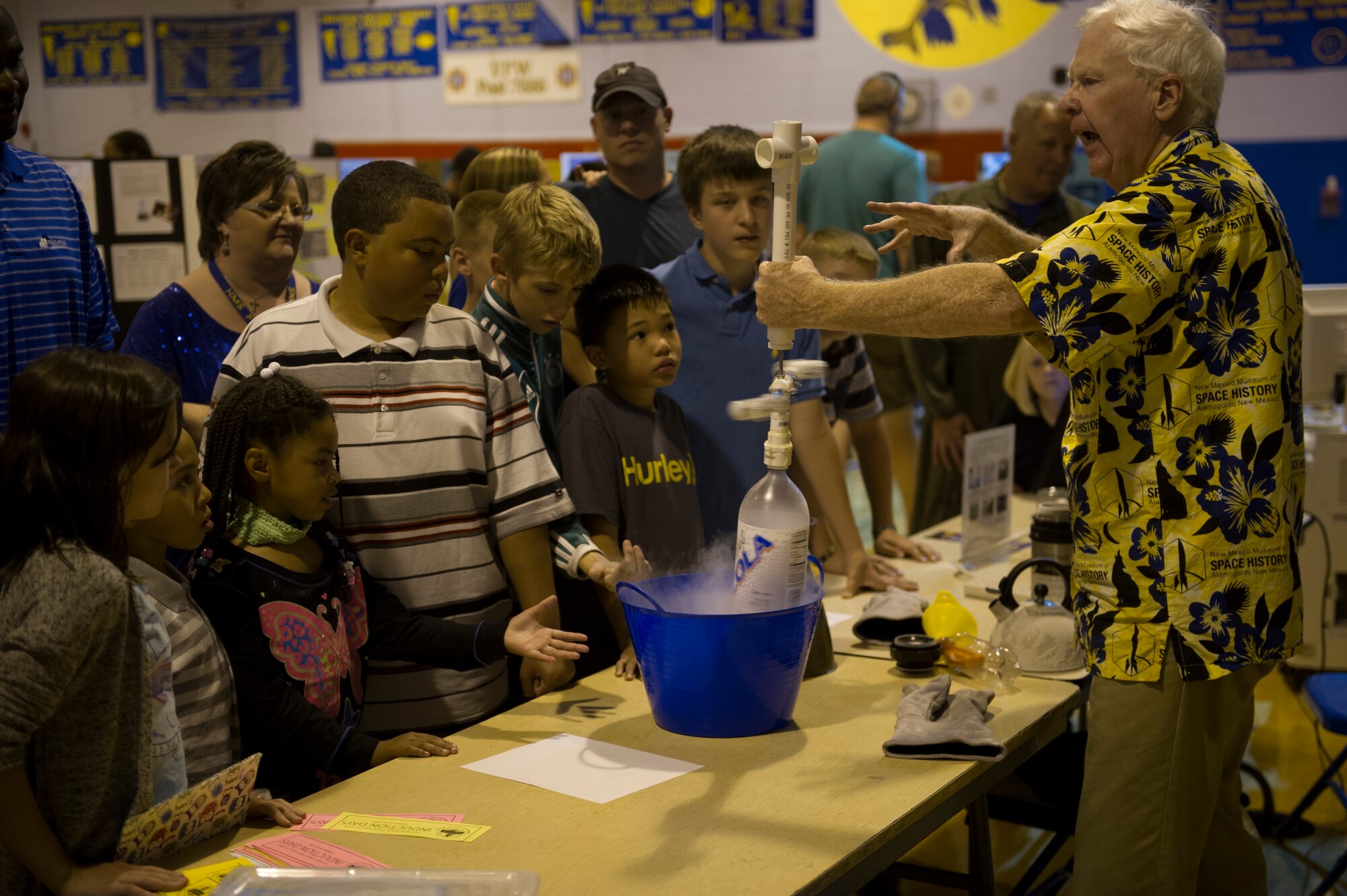 Students gather to see the magic of liquid nitrogen during the Mesa Science Discovery Night at the Holloman Air Force Base Middle School, Oct. 10. The school hosted exhibits from different squadrons around base along with projects that had been put together and presented by the students of the middle school. (U.S. Air Force Photo by Airman 1st Class Chase Cannon/Released)