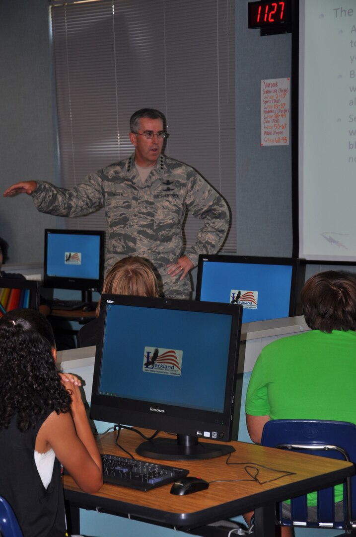 General John E. Hyten, Air Force Space Command commander, talks to Virginia Allred Stacey Junior/Senior High School students about the advantages of early exposure to advanced technology during a visit to Joint Base San Antonio - Lackland, Texas, Sept. 3. Members of 24th Air Force, who fall under the general's command, mentor CyberPatriot participants at Stacey annually as part of the national high school cyber defense competition. This year, more than 100 teams are participating from across the greater San Antonio area, include 24 middle schools. (U.S. Air Force photo/Christine D. Millette)