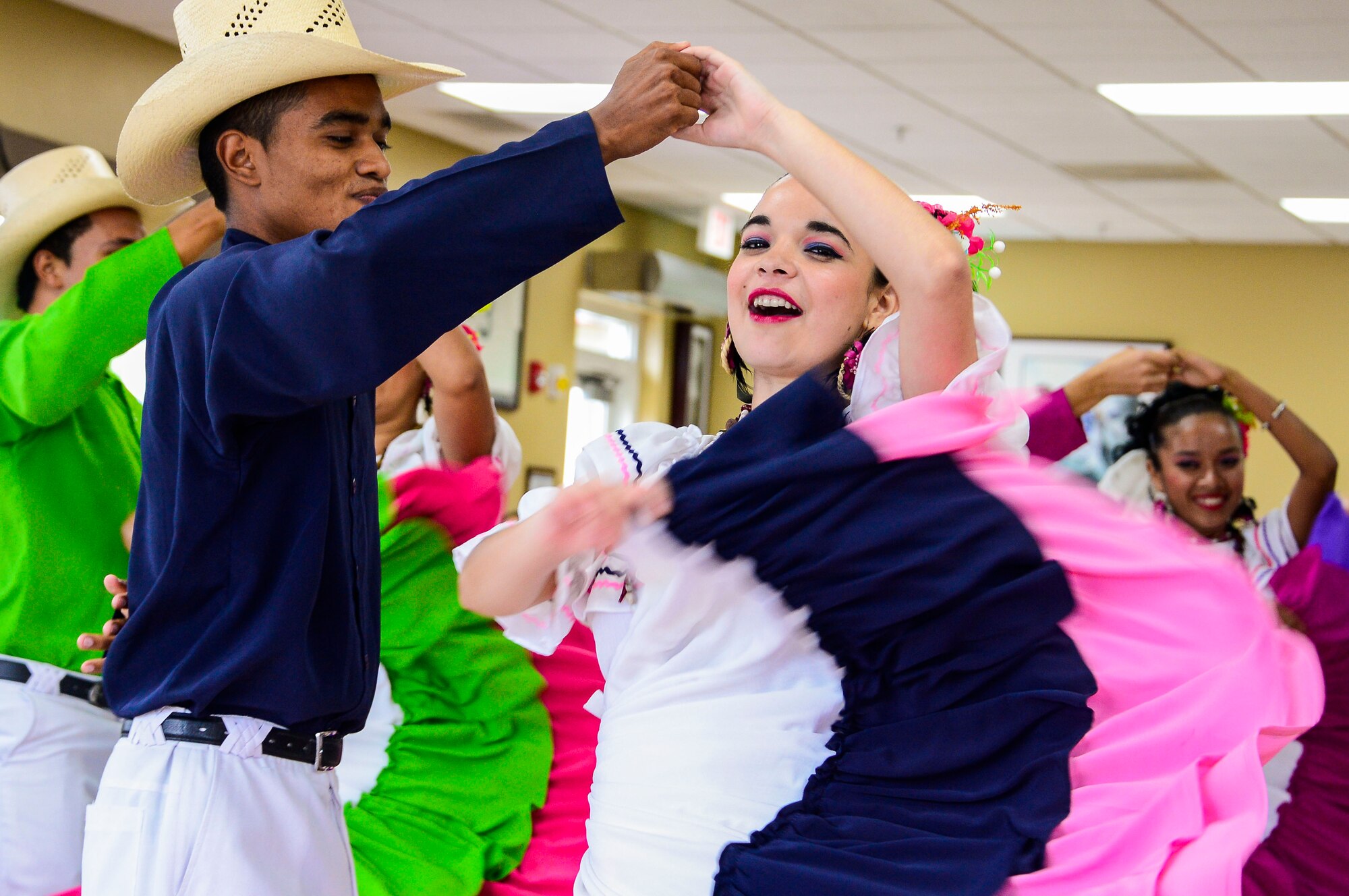 Folk dance performers from the Escuela Normal Centro América entertain the members of Joint Task Force-Bravo during Hispanic Heritage Month celebration at the dining facility on Soto Cano Air Base, Honduras, Oct. 9, 2014.  In celebration of Hispanic Heritage Month, JTF-B coordinated performances from the Honduran Navy Band stationed in Tegucigalpa,  the official folk dance group from the Escuela Normal Centro América, as well as a couple of performers  from the Dilcia Mejia Dance School. (U.S. Air Force Photo by Tech. Sgt. Heather Redman/Released)