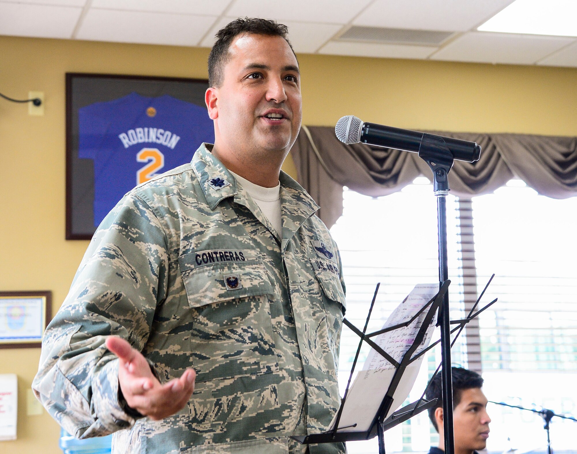 U.S. Air Force Lt. Col. Matthew Contreras, deputy commander of Joint Task Force-Bravo gives the key note speech celebrating Hispanic Heritage Month at the dining facility on Soto Cano Air Base, Honduras, Oct. 9, 2014.  In celebration of Hispanic Heritage Month, JTF-B coordinated performances from the Honduran Navy Band stationed in Tegucigalpa,  the official folk dance group from the Escuela Normal Centro América, as well as a couple of performers  from the Dilcia Mejia Dance School. (U.S. Air Force Photo by Tech. Sgt. Heather Redman/Released)