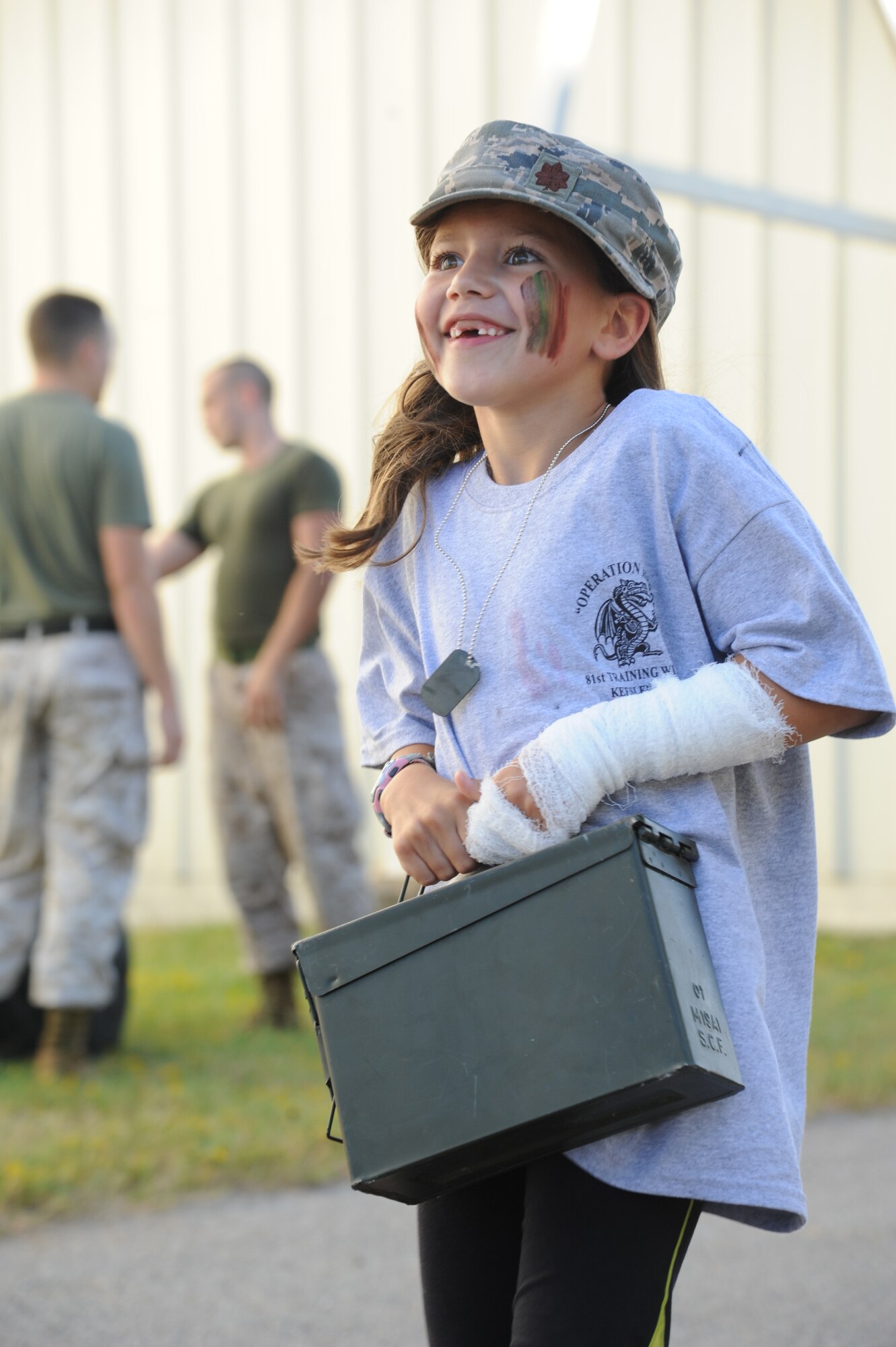 The daughter of  Maj. Billy Pope, 81st Communications Squadron commander, participates in the Marine obstacle course during Operation Hero Oct. 11, 2014, at Keesler Air Force Base, Miss.  The event was designed to help children better understand what happens when their parents deploy.  (U.S. Air Force photo by Kemberly Groue)