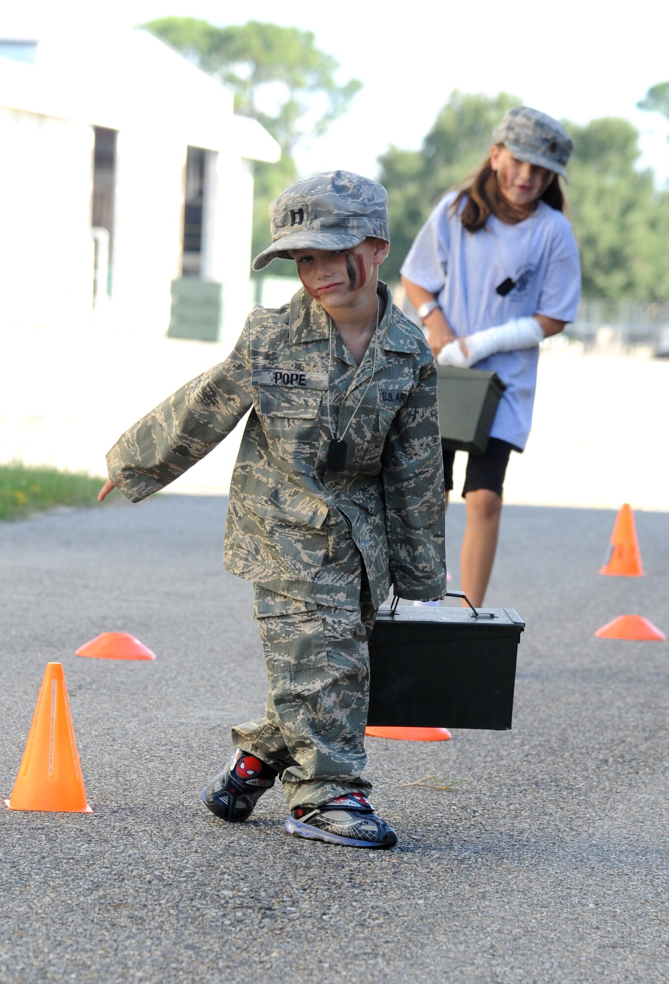 The children of  Maj. Billy Pope, 81st Communications Squadron commander, participate in the Marine obstacle course during Operation Hero Oct. 11, 2014, at Keesler Air Force Base, Miss.  The event was designed to help children better understand what happens when their parents deploy.  (U.S. Air Force photo by Kemberly Groue)
