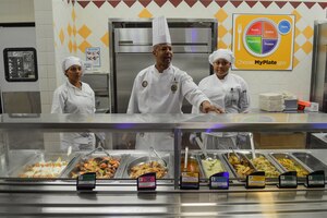 U.S. Army Chief Charles H. Talley Jr., Joint Culinary Center of Excellence chief, prepares to serve the lunch offerings at the 7th Transportation Brigade (Expeditionary) Resolute Dining Facility at Fort Eustis, Va., Oct. 1, 2014. The JCCoE team worked with the Resolute Dining Facility culinary specialists to assist with modernizing menus that draw in more customers. (U.S. Army photo by Spc. Marian Alleva/Released)