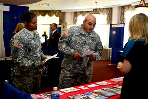 U.S. Army Sgt. 1st Class Karrina Rodriguez, 11th Transportation Battalion Headquarters and Headquarters Detachment detachment sergeant, and Staff Sgt. Joseph Guzman, 11th Trans. Bn., 368th Transportation company platoon sergeant, speak to a vendor during a Government Technology Exhibit at Fort Eustis, Va., Oct. 9, 2014. Participants had the ability to visit more than 30 vendors that exhibited new advances in technology. (U.S. Air Force photo by Airman 1st Class Kimberly Nagle/Released) (No federal endorsement of vendors implied)