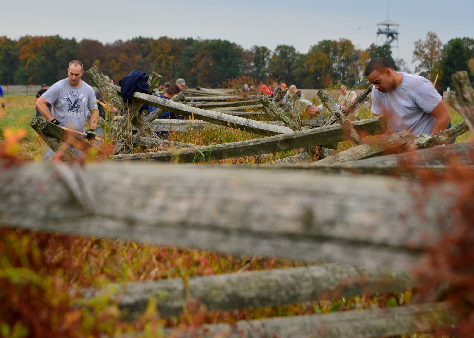 Team Dover volunteer Airmen work to clear and rebuild a 300 yard fence line Oct. 10, 2014, at Gettysburg National Military Park, Pa. More than 100 volunteer Airmen showed up to the event which was organized by the Dover Air Force Base First Sergeants Council. (U.S. Air Force photo/Airman 1st Class William Johnson)