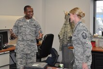 Gen. Darren McDew, Air Mobility Command commander, speaks with Master Sgt. Heather Mousseau, 911th Air Refueling Squadron production superintendent during his visit to Seymour Johnson Air Force Base, Sept. 23, 2014. McDew visited to meet the Airmen of the 916th ARW and its Total Force Associate partner, the 911th ARS. (USAF photo by Staff Sgt. Alan Abernethy, 916ARW/PA) 