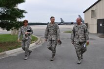 Chief Master Sgt. Victoria Gamble, Air Mobility Command command chief, Chief Master Sgt. James Loper, 916th Air Refueling Wing command chief, and Chief Master Sgt. Dallas Turner, 911th Air Refueling Squadron chief enlisted manager, talk while walking near the 916th ARW ramp, Seymour Johnson Air Force Base, North Carolina. Gamble accompanied Gen. Darren McDew, AMC commander, during his visit to the base to meet the Airmen of the 916th ARW and its Total Force Associate partner, the 911th ARS, Sept. 23, 2014. (USAF photo by Staff Sgt. Alan Abernethy, 916ARW/PA) 