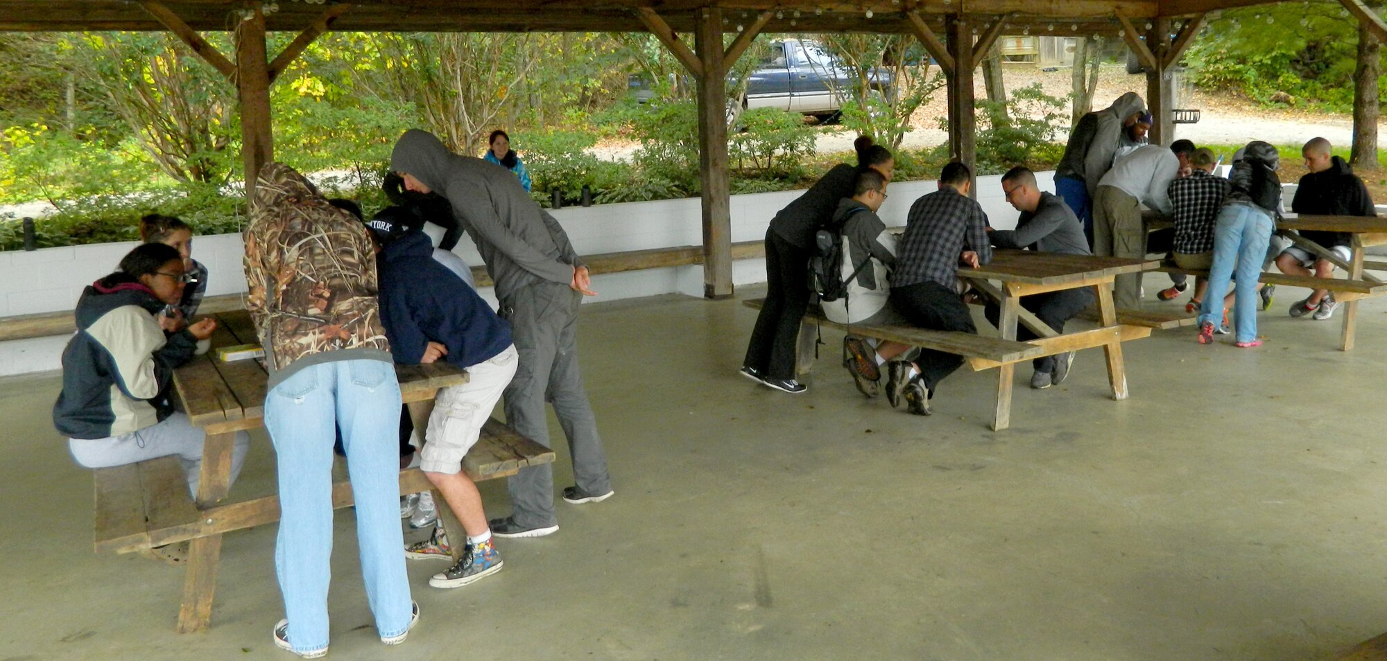 Airmen compete to complete a puzzle during a Joint Base Andrews Resiliency Retreat at Wilderness Adventure at Eagle Landing in New Castle, Va., Oct. 1, 2014. Teams had to face multiple challenges such as not being able to talk, some closing their eyes and regaining swapped pieces. This exercise was the show Airmen that sometimes to complete the task at hand, they need to utilize an outside source. (U.S. Air Force photo/Tech. Sgt. Krystal Cruz)