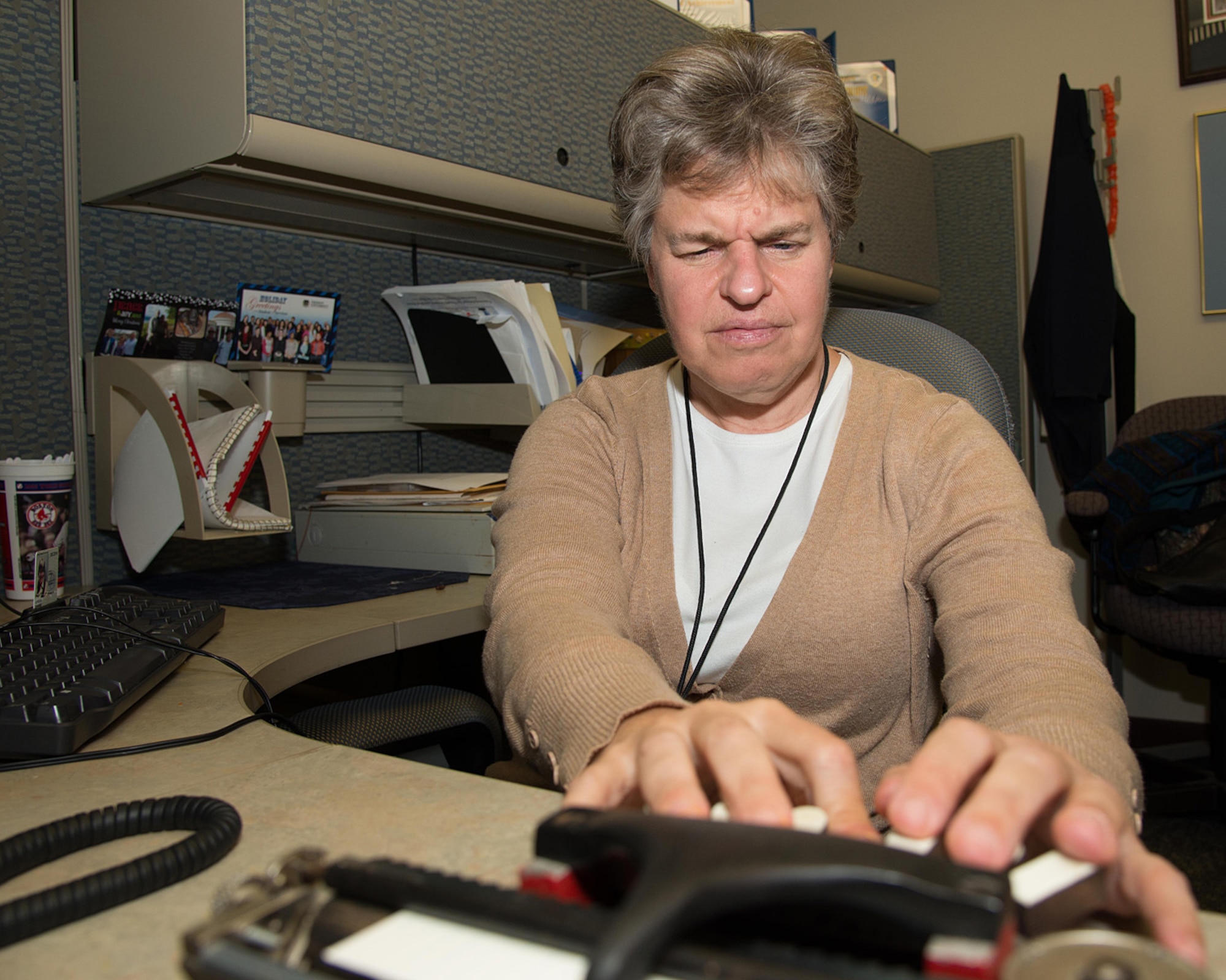 Joanne Jordan, C3I and Networks Directorate lead information manager, uses a braille writer while at her desk to communicate with supervisors and others in her program, Oct. 14. October is National Disability Employment Awareness Month that is celebrated each year to educate people on disability employment as well as to recognize the contributions of employees with disabilities. (U.S. Air Force photo by Mark Herlihy)