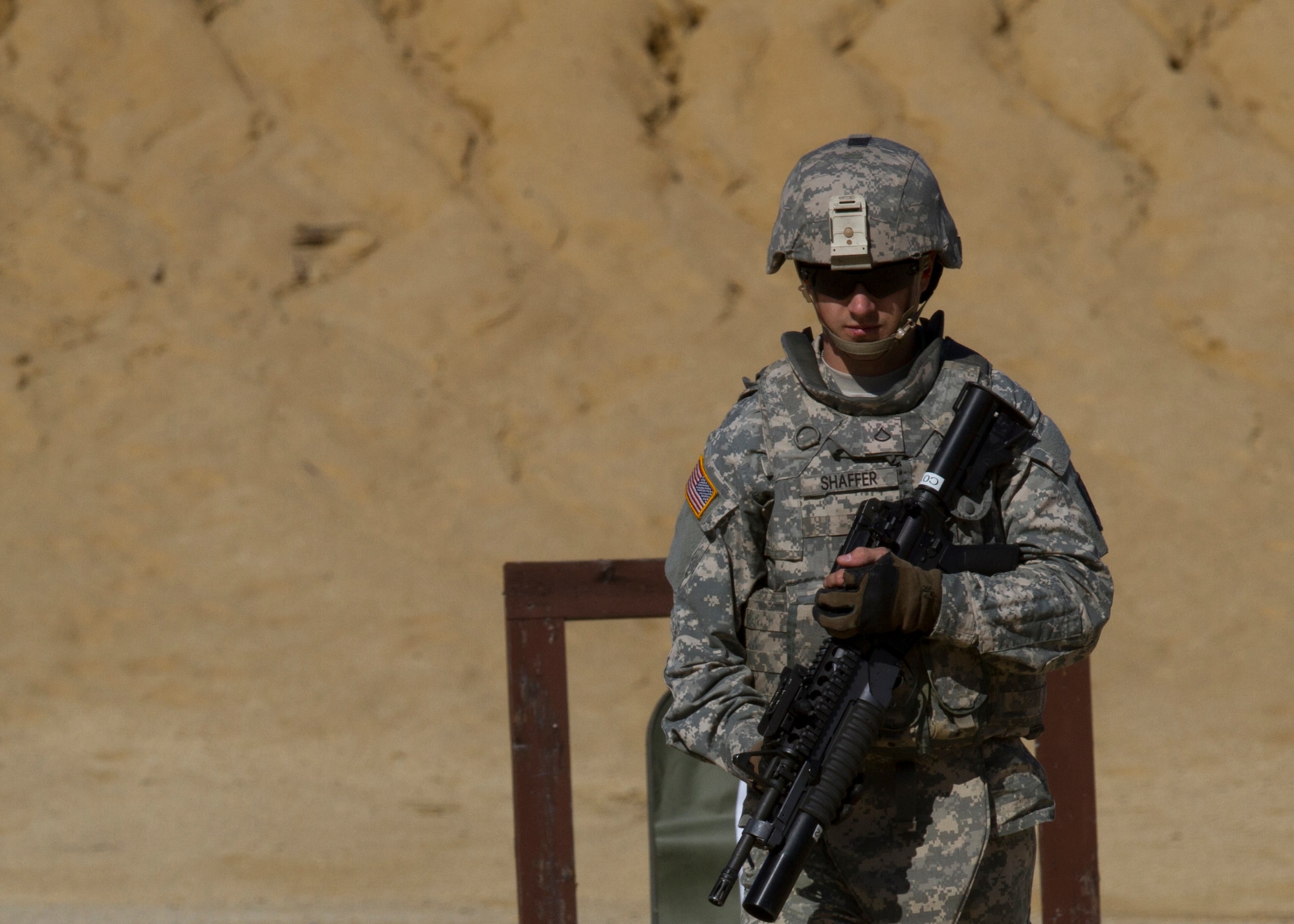 Army Pfc. Shaffer, from the 362nd MP Detachment, walks off the range for reactive fire Oct. 6, 2014, on Joint Base McGuire-Dix-Lakehurst, N.J. The unit is pre-mobilizing later this year to Romania. (Photo by Army Sgt. Reba Benally/Released)