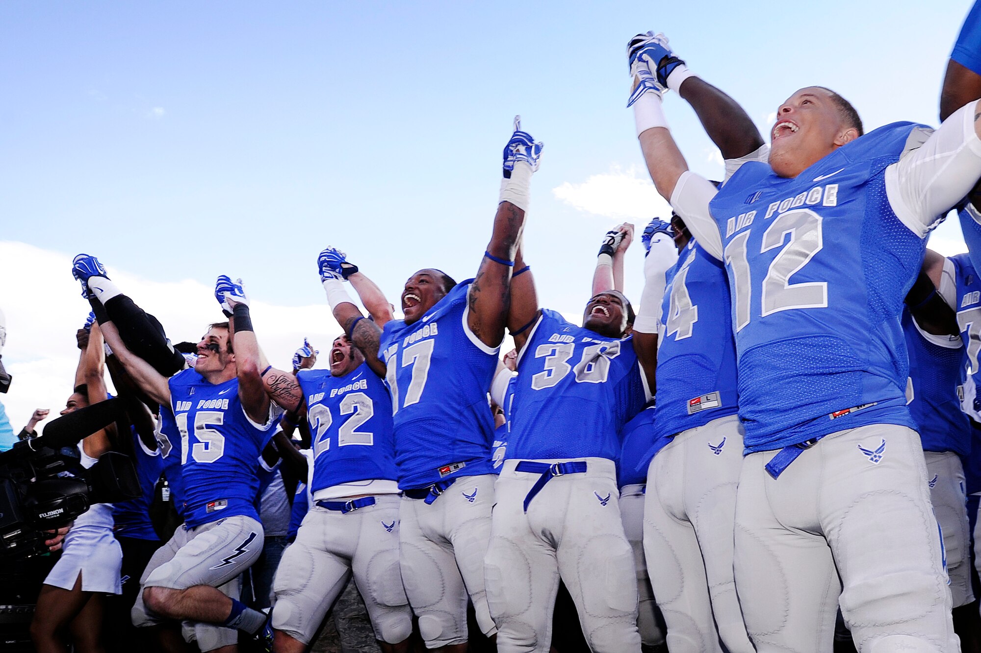 Falcon Football players cheer after beating Navy 30-21 here Oct. 4. The Air Force Academy Inspector General Office completed its inspection of the Academy Athletic Department and the overall grade of the inspection was "effective." This grade indicates that the Athletic Department performs its mission. (U.S. Air Force photo/Mike Kaplan) 