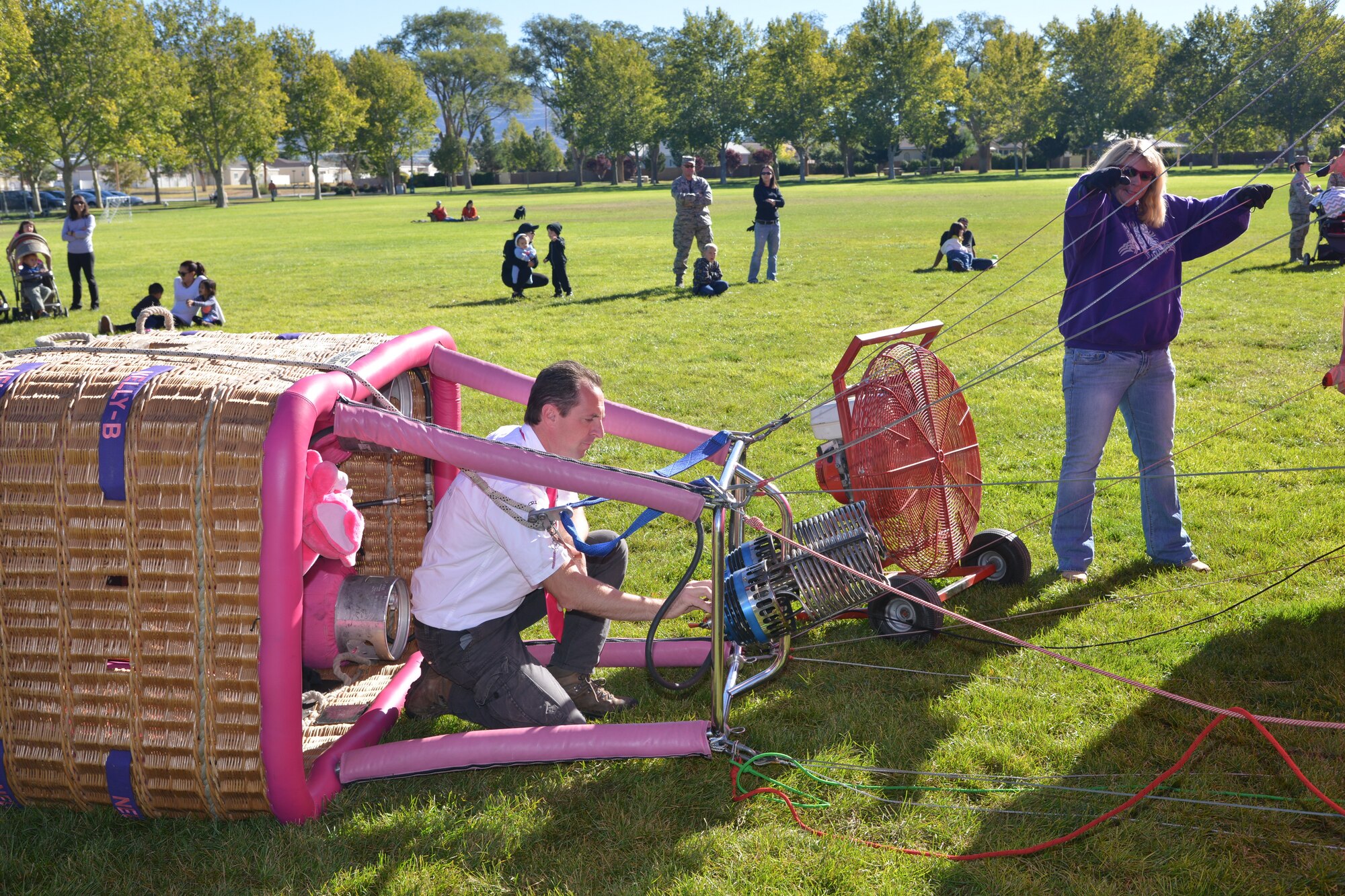 Peter Van Overwalle prepares to inflate his Nelly-B hot air balloon, Overwalle comes to Albuquerque each year for Balloon Fiesta and always makes a stop at the base to show off his balloon to the children. (Photo by Todd Berenger)