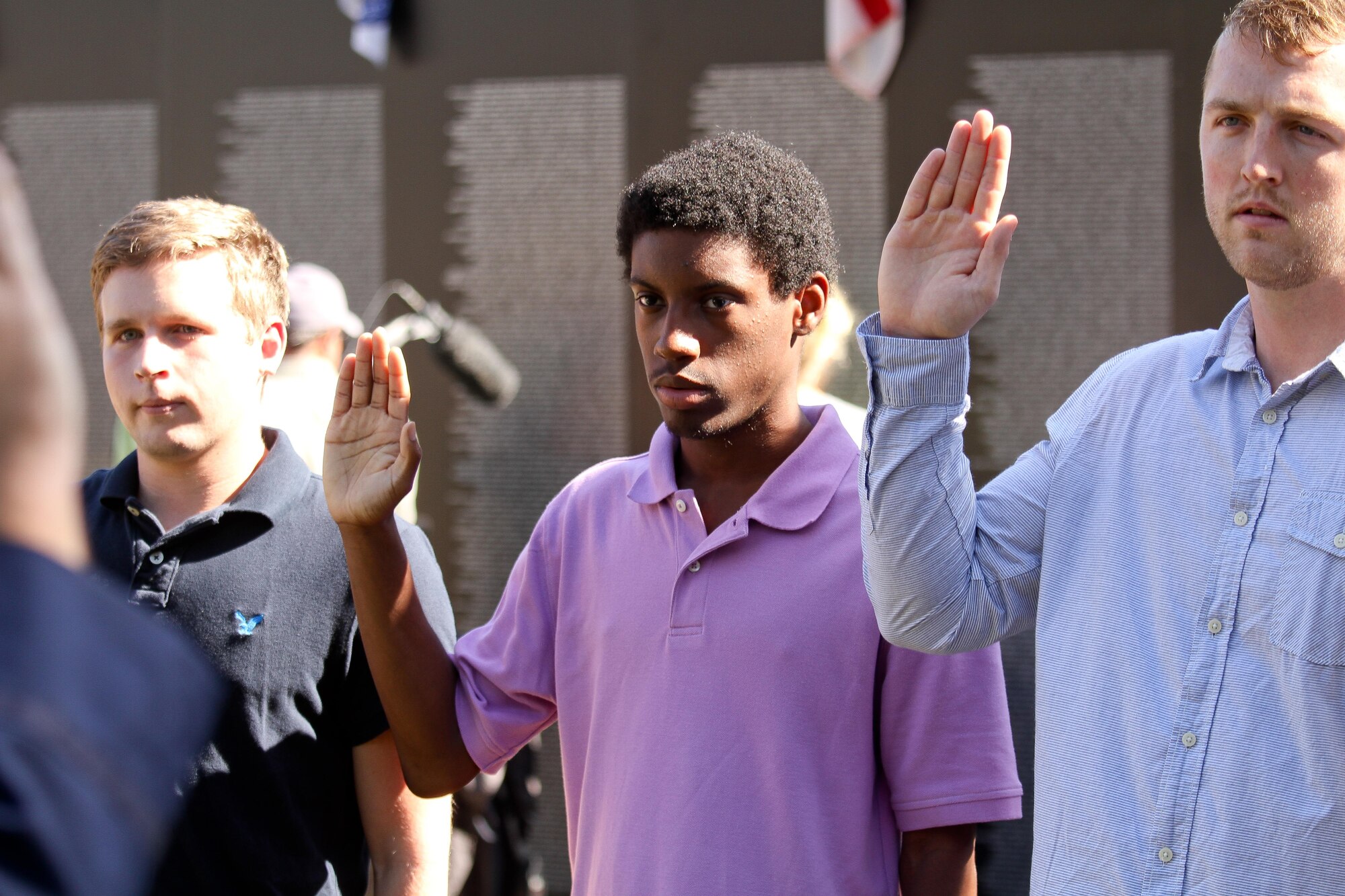 New Air Force Reserve enlistee Czar Dixon raises his right hand during and enlistment ceremony Oct. 10, 2014 in front of the Vietnam War Memorial at the Patriots Point Naval and Maritime Museum in Mount Pleasant, South Carolina. Dixon will be assigned to the 315th Aircraft Maintenance Squadron at Joint Base Charleston, South Carolina. (U.S. Air Force photo by Staff Sgt. Rashard Coaxum)