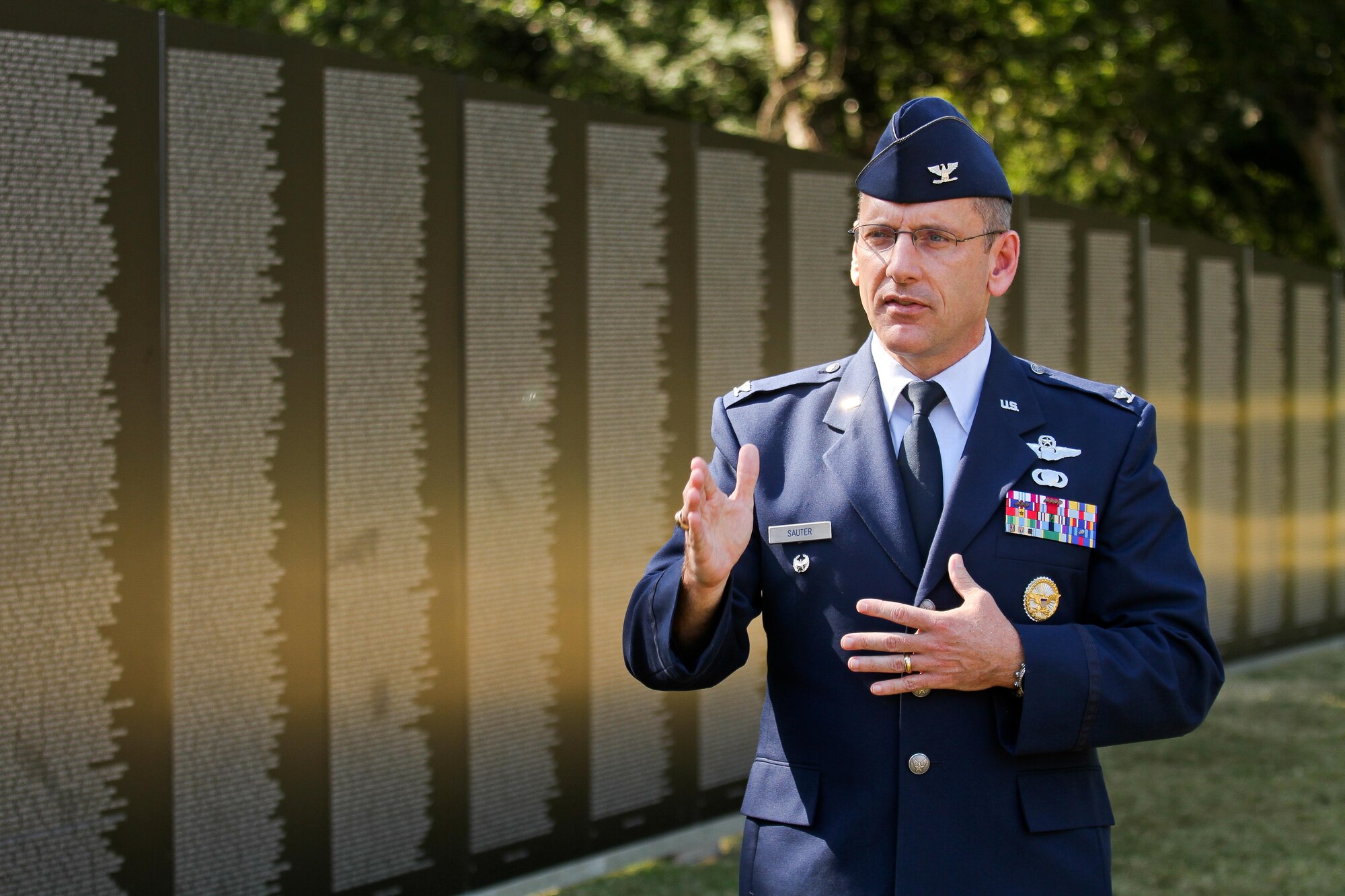 315th Airlift Wing Commander, Col. Scott Sauter gives words of encouragement to a group of new enlistees before they take their oaths of enlistment Oct. 10, 2014 in front of the Vietnam War Memorial at the Patriots Point Naval and Maritime Museum in Mount Pleasant, South Carolina. (U.S. Air Force photo by Staff Sgt. Rashard Coaxum)