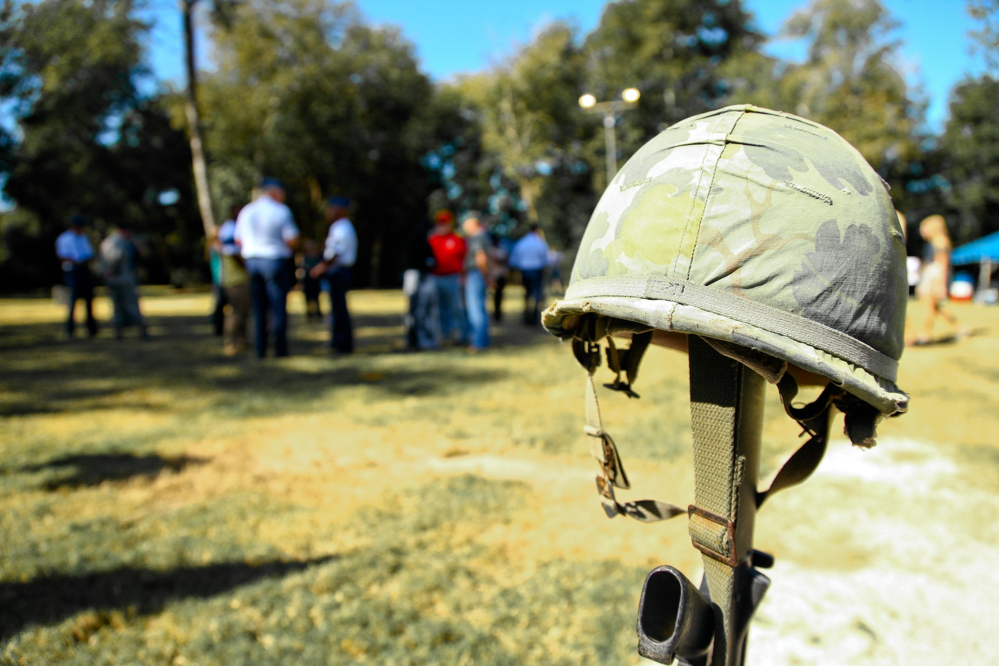 A fallen service member’s helmet rests on an M-16 rifle in front of the Vietnam War Memorial Oct. 10, 2014 at the Patriots Point Naval and Maritime Museum in Mount Pleasant, South Carolina. Seven new Joint Base Charleston, South Carolina, members were enlisted near the Memorial during a mass enlistment ceremony.. (U.S. Air Force photo by Staff Sgt. Rashard Coaxum)