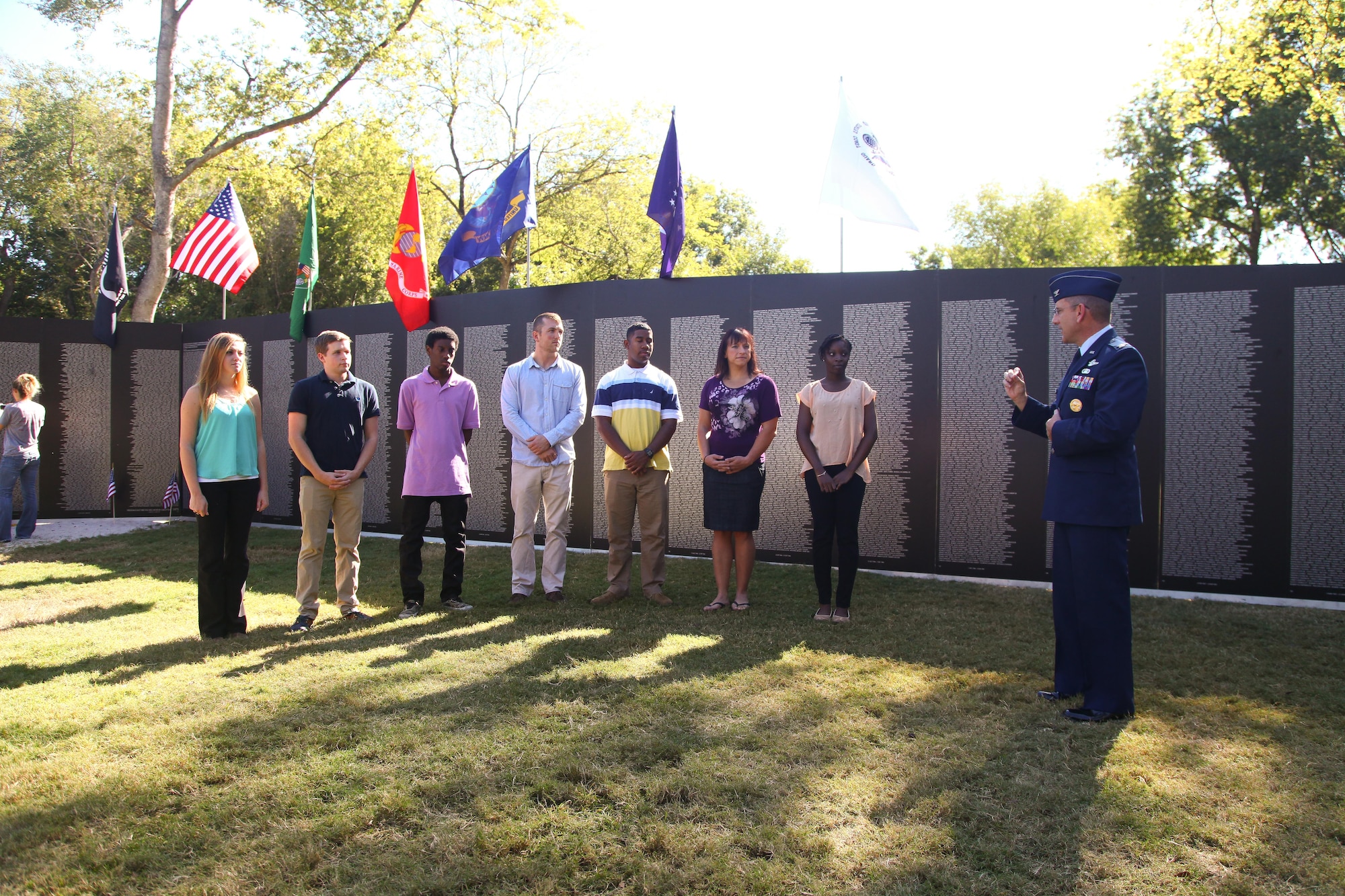 315th Airlift Wing Commander, Col. Scott Sauter gives encouraging words to a group of new enlistees before they take their oaths of enlistment Oct. 10, 2014 in front of the Vietnam War Memorial at the Patriots Point Naval and Maritime Museum in Mount Pleasant, South Carolina. (U.S. Air Force photo by Staff Sgt. Rashard Coaxum)