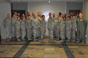 Chief Master Sgt. Craig Hall, 460th Space Wing command chief, stands among enlisted members at the Air Reserve Personnel Center Oct. 10, 2014, on Buckley Air Force Base, Colo. Hall was greeted by Chief Master Sgt. Ruthe Flores, ARPC command chief, then spoke to enlisted personnel in the center’s lobby as to bid farewell, thank them for their service and let them know the impact they made on him. (U.S. Air Force photo/Tech. Sgt. Rob Hazelett)