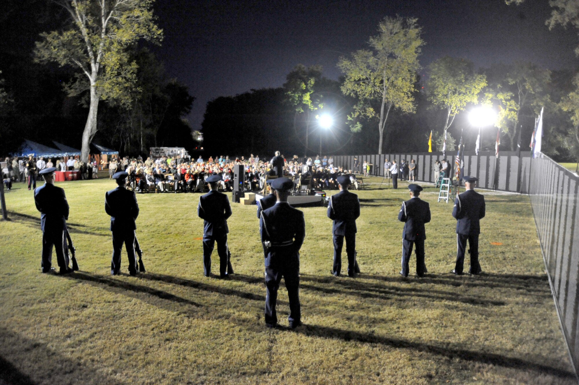The Joint Base Charleston Honor Guard stands at parade rest during the opening ceremony for the traveling Vietnam Memorial tribute wall at Patriots Point Naval & Maritime Museum, Oct. 9, 2014, in Mt. Pleasant, S.C. The tribute wall was on display through Oct. 12. The opening ceremony included remarks by Medal of Honor Recipient Maj. Gen. James Livingston, several state and local officials, a performance by the U.S. Marine Corps Band of Parris Island and a gun salute by the JB Charleston Honor Guard. Col. Jeffrey DeVore, JB Charleston commander, Navy Capt. Timothy Sparks, JB Charleston deputy commander, and Col. John Lamontagne, 437th Airlift Wing commander were also in attendance. (Courtesy photo/Patriots Point).